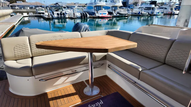  Yacht Photos Pics Luxurious 2018 Sea Ray Fly 510 yacht interior with elegant seating and wooden table.