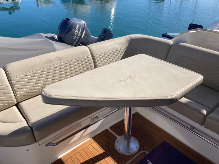  Yacht Photos Pics Luxurious seating area on 2018 Sea Ray Fly 510 yacht with elegant table.