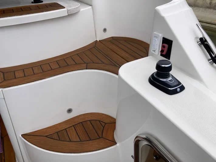  Yacht Photos Pics 2018 Sea Ray Fly 510 boat deck with wood finish and control joystick.