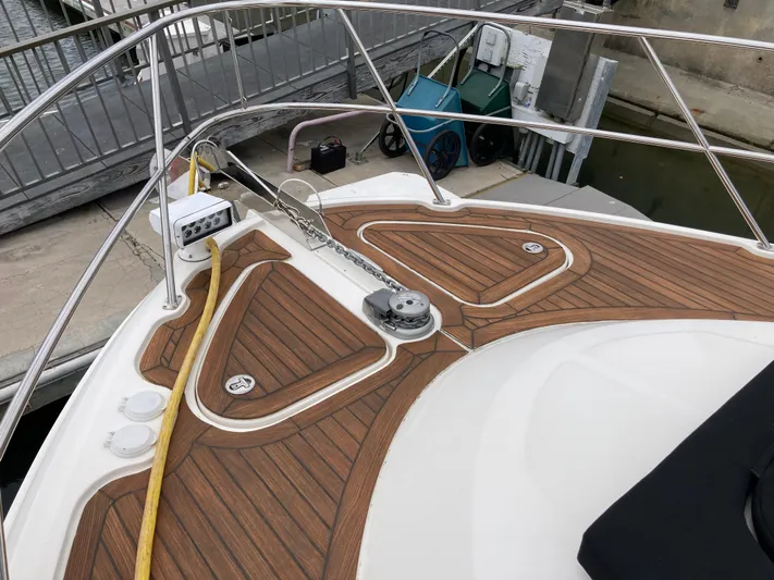 Yacht Photos Pics 2018 Sea Ray Fly 510 yacht deck with teak flooring and railing.