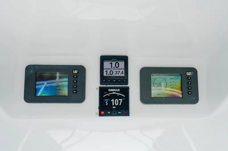 Water's Edge Yacht Photos Pics Control panel of 2005 Hatteras Convertible 60 yacht with navigation displays.