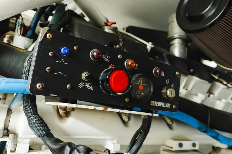 Water's Edge Yacht Photos Pics Engine control panel of a 2005 Hatteras Convertible 60 yacht with Caterpillar components.