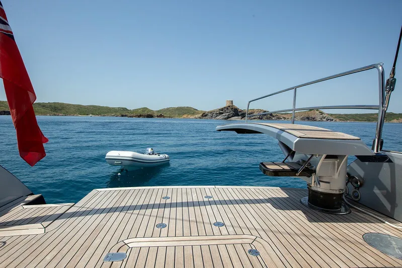 Caiarossa Yacht Photos Pics Luxury Shipman 72 yacht deck with scenic ocean view, inflatable boat, and distant island, 2009 model.