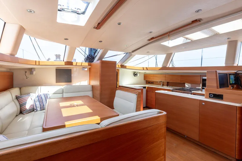 Caiarossa Yacht Photos Pics Luxurious interior of 2009 Shipman 72 yacht with modern kitchen and seating area.