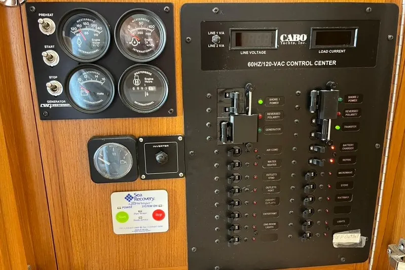 Assalt Weapon Yacht Photos Pics Control panel of a 2007 Cabo 35 Flybridge yacht with gauges and switches.