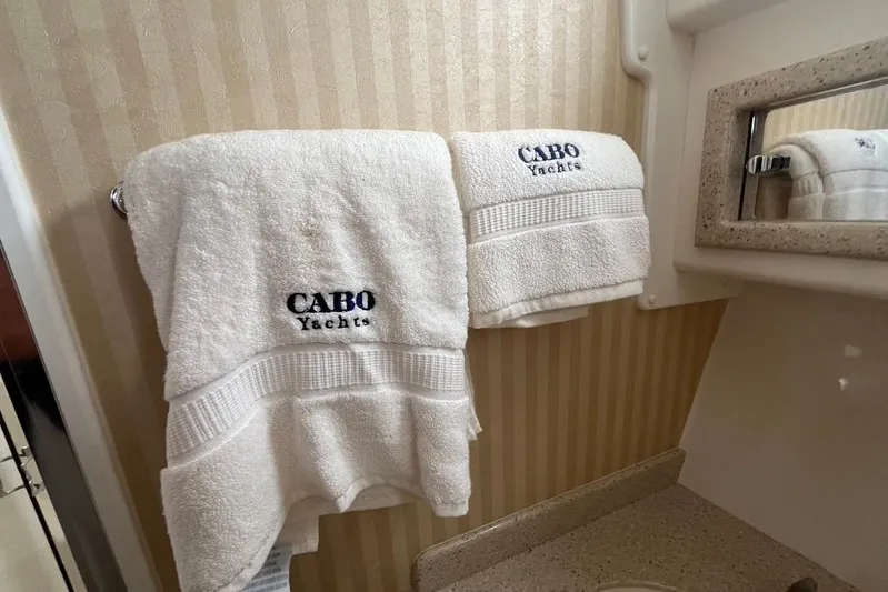Assalt Weapon Yacht Photos Pics White towels with "Cabo Yachts" logo in a 2007 Cabo 35 Flybridge bathroom.