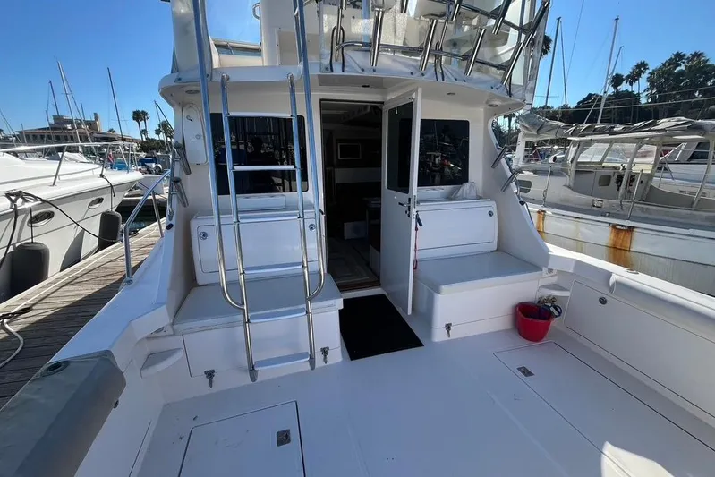 Assalt Weapon Yacht Photos Pics 2007 Cabo 35 Flybridge yacht with open deck and marina view.
