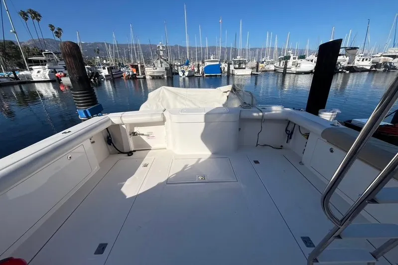 Assalt Weapon Yacht Photos Pics 2007 Cabo 35 Flybridge boat docked in a marina with clear blue skies.