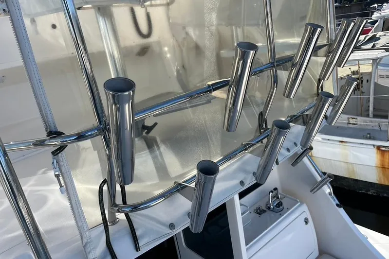 Assalt Weapon Yacht Photos Pics Rod holders on a 2007 Cabo 35 Flybridge boat, featuring stainless steel construction.