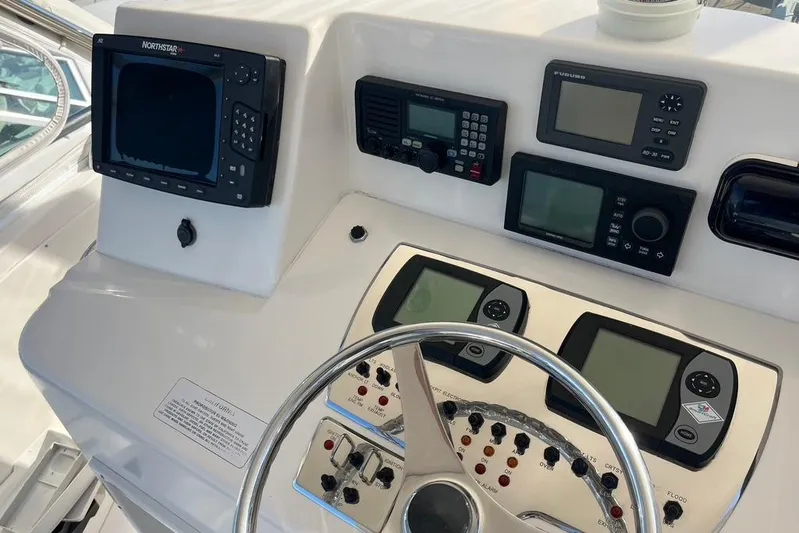 Assalt Weapon Yacht Photos Pics Helm of 2007 Cabo 35 Flybridge with navigation and control instruments.