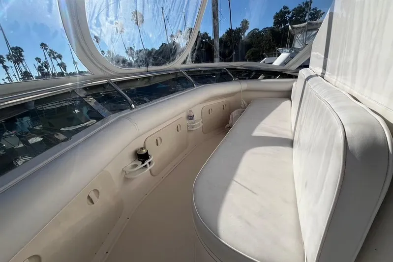 Assalt Weapon Yacht Photos Pics 2007 Cabo 35 Flybridge interior with white seating and panoramic windows.