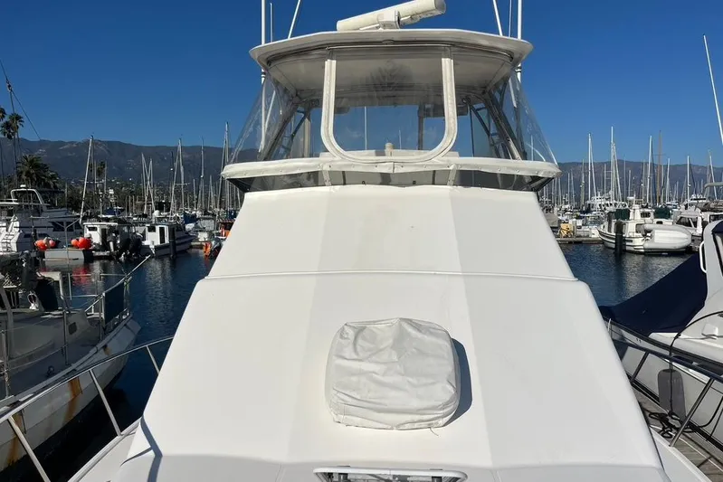 Assalt Weapon Yacht Photos Pics 2007 Cabo 35 Flybridge yacht docked in a marina, surrounded by other boats.