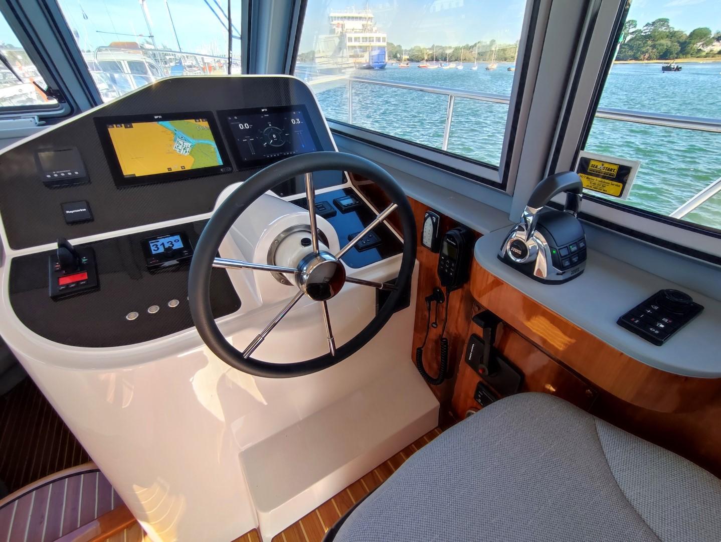 Helm of 2017 Elling E4 Ultimate yacht with navigation controls and steering wheel.