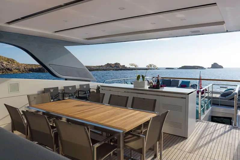 Musha Yacht Photos Pics Luxurious Sanlorenzo 579 yacht deck with dining area, ocean view, and modern design, 2012 model.
