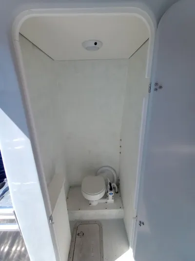  Yacht Photos Pics Compact marine bathroom with toilet in a Custom 34 model, 2025.