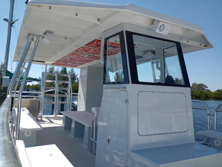  Yacht Photos Pics Custom 34 boat, 2025 model, docked with modern design and spacious deck.