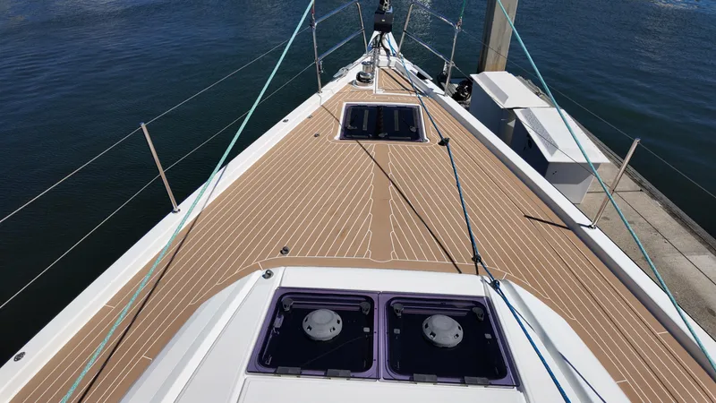  Yacht Photos Pics Jeanneau 51 sailboat deck, 2021 model, docked with visible hatches and rigging.