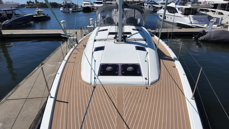  Yacht Photos Pics 2021 Jeanneau 51 yacht with sleek deck design, docked at marina.