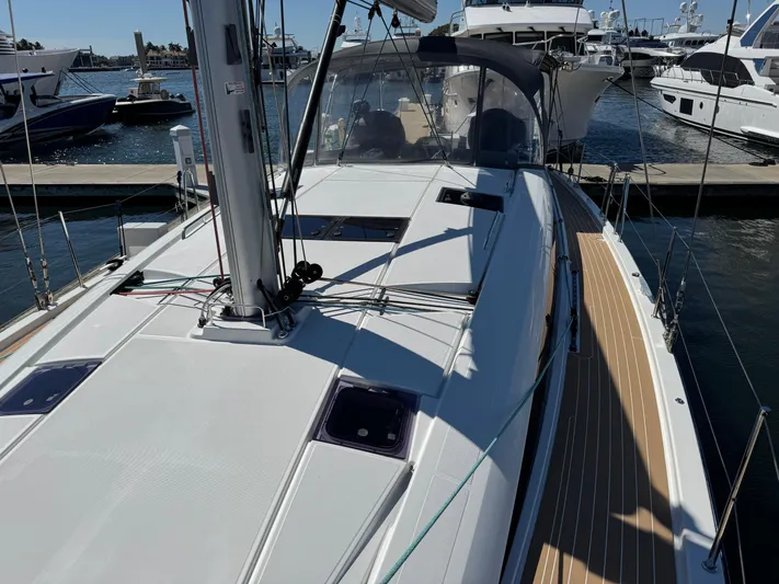  Yacht Photos Pics 2021 Jeanneau 51 sailboat docked at marina, showcasing sleek deck design.