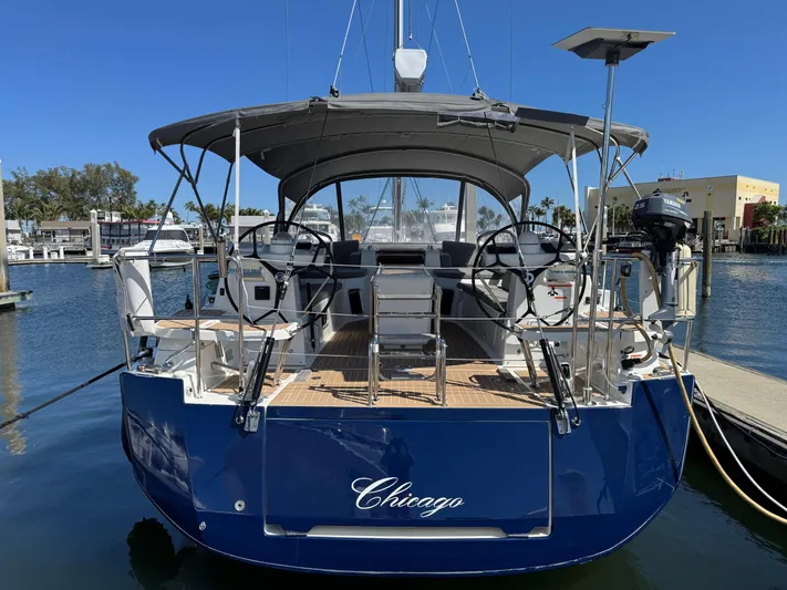  Yacht Photos Pics 2021 Jeanneau 51 yacht docked, rear view, with "Chicago" on the stern.