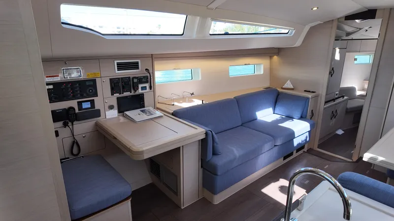  Yacht Photos Pics Interior of 2021 Jeanneau 51 yacht with modern seating and navigation area.