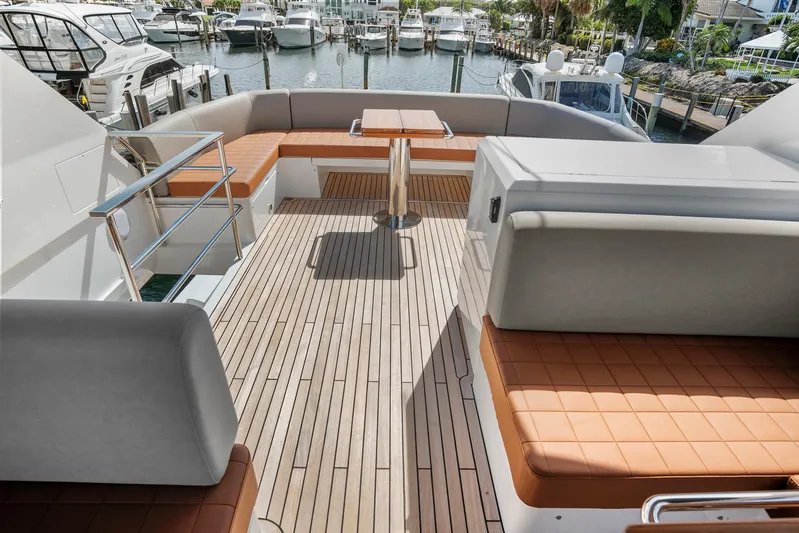 My Way Yacht Photos Pics Luxurious 2023 Astondoa AS5 yacht deck with seating and table, docked at marina.
