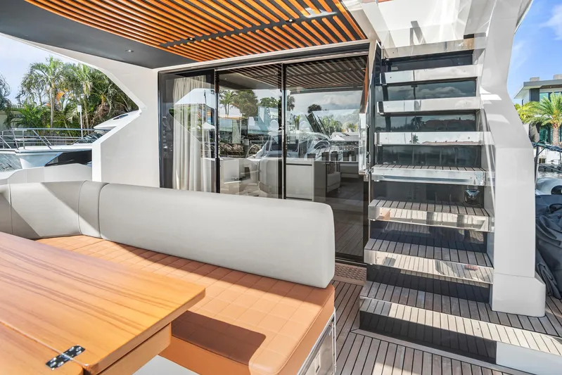 My Way Yacht Photos Pics Luxurious 2023 Astondoa AS5 yacht deck with modern seating and glass staircase.