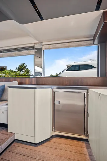 My Way Yacht Photos Pics Luxurious interior of 2023 Astondoa AS5 yacht with modern cabinetry and scenic window view.