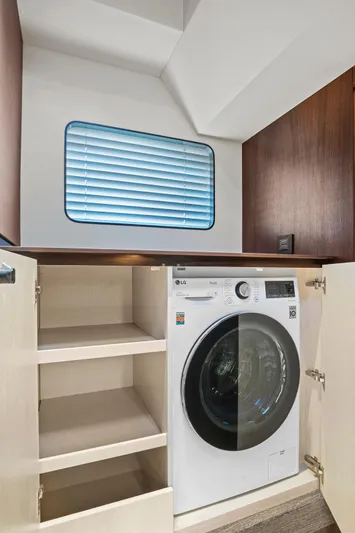 My Way Yacht Photos Pics 2023 Astondoa AS5 yacht interior with built-in washer and storage shelves.
