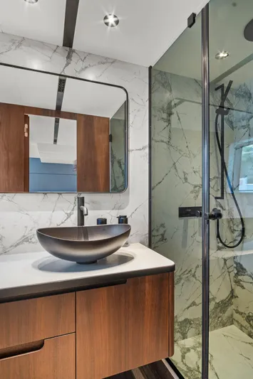 My Way Yacht Photos Pics Luxurious bathroom in 2023 Astondoa AS5 yacht with modern fixtures and marble accents.