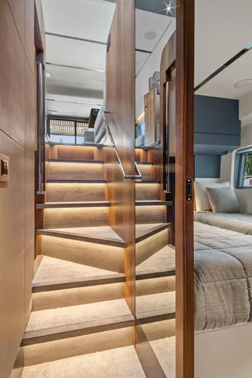 My Way Yacht Photos Pics Luxurious interior of 2023 Astondoa AS5 yacht with elegant wooden staircase and modern bedroom.