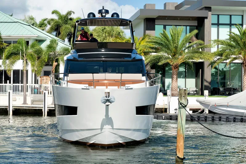 My Way Yacht Photos Pics 2023 Astondoa AS5 yacht docked near modern waterfront homes and palm trees.