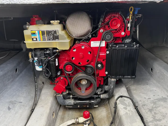  Yacht Photos Pics Engine compartment of 2024 NX Boats 280 Xtreme, showcasing a red marine engine.