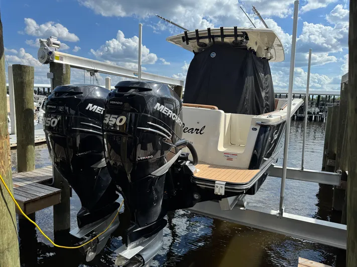  Yacht Photos Pics 2021 Scout 330 LXF boat with twin Mercury 350 Verado engines on a lift.