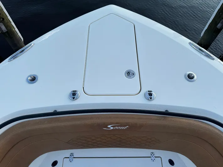  Yacht Photos Pics Bow of 2021 Scout 330 LXF boat with storage hatch and logo.
