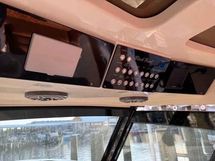  Yacht Photos Pics 2021 Scout 330 LXF boat dashboard with control panel and Seakeeper system.