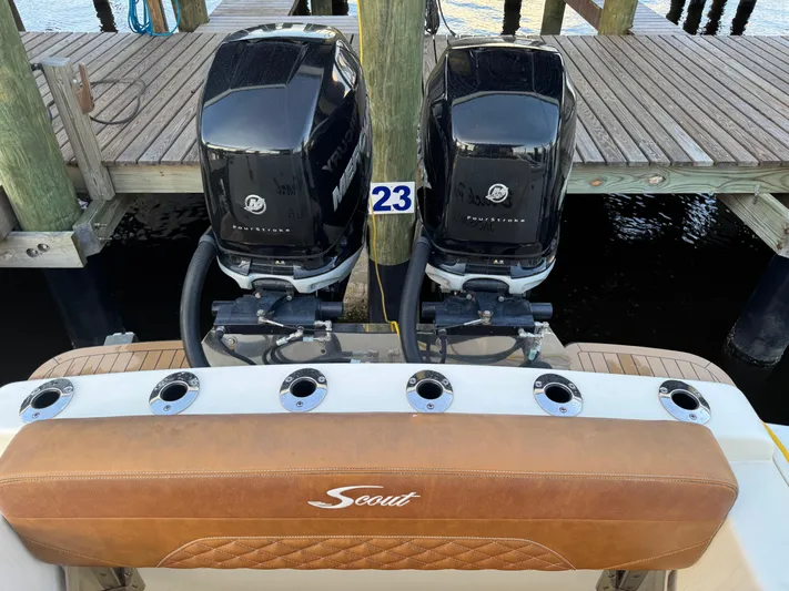  Yacht Photos Pics 2021 Scout 330 LXF boat with dual Mercury outboard engines at dock.