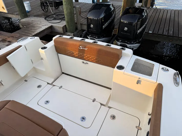  Yacht Photos Pics 2021 Scout 330 LXF boat interior with twin Mercury engines at dock.
