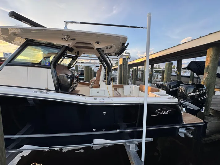  Yacht Photos Pics 2021 Scout 330 LXF boat docked with Mercury engines, side view.