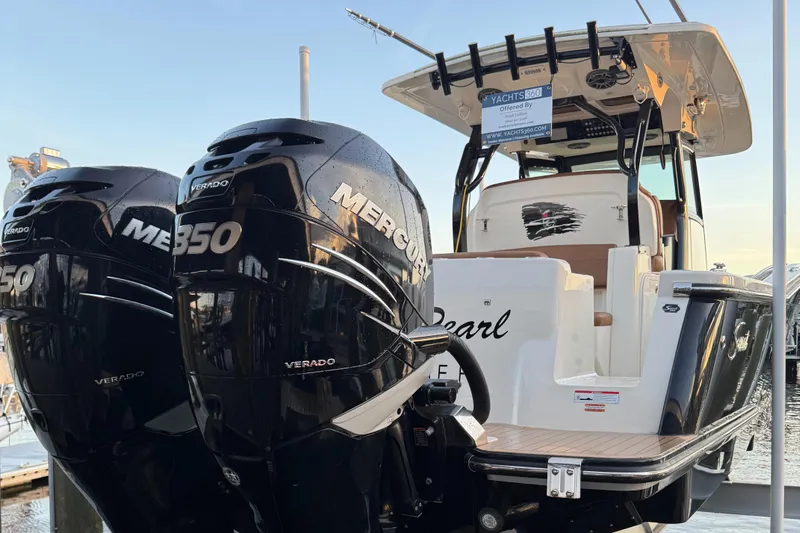  Yacht Photos Pics 2021 Scout 330 LXF boat with twin Mercury 350 Verado engines at dock.