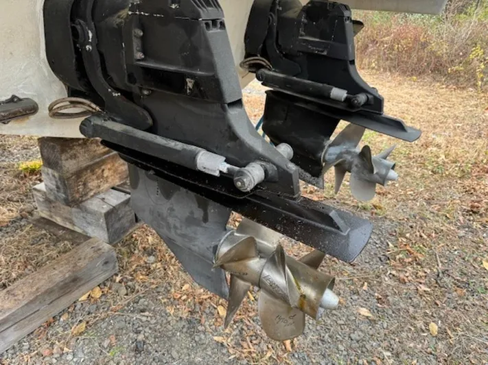  Yacht Photos Pics 2013 Formula 350 Sun Sport boat propellers on dry land, showcasing dual outdrive system.