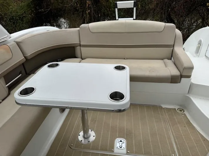  Yacht Photos Pics 2013 Formula 350 Sun Sport boat interior with beige seating and a table with cup holders.