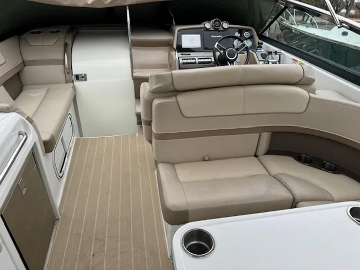  Yacht Photos Pics 2013 Formula 350 Sun Sport boat interior with beige seating and modern dashboard.