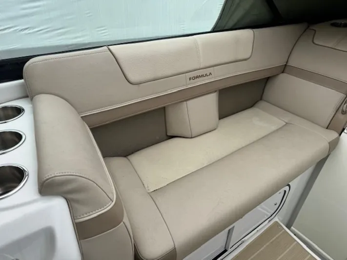  Yacht Photos Pics 2013 Formula 350 Sun Sport boat interior with beige seating and cup holders.