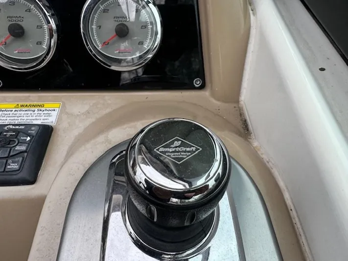  Yacht Photos Pics Control panel of a 2013 Formula 350 Sun Sport boat with gauges and a chrome knob.