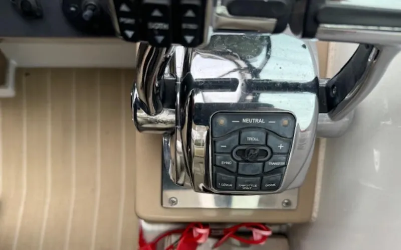  Yacht Photos Pics Control panel of a 2013 Formula 350 Sun Sport boat with throttle and buttons.