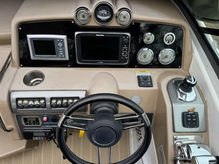  Yacht Photos Pics 2013 Formula 350 Sun Sport dashboard with steering wheel, gauges, and navigation system.