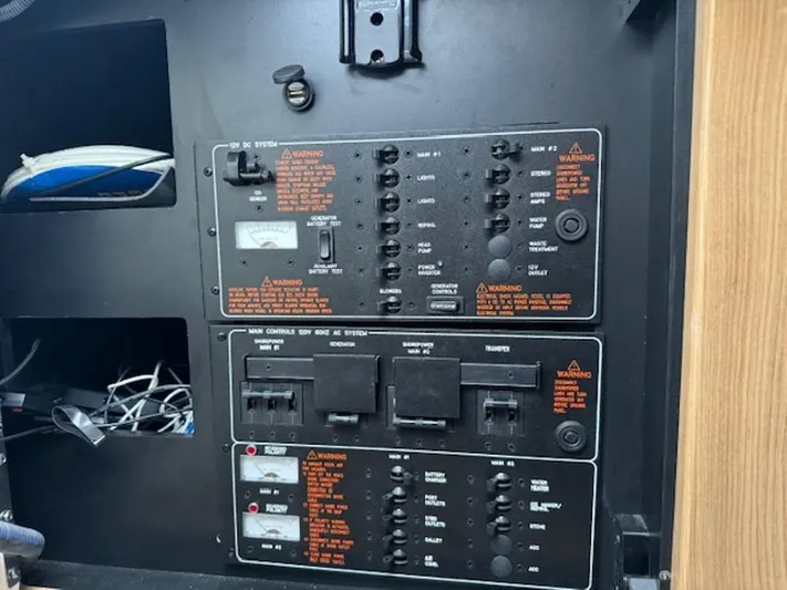  Yacht Photos Pics Control panel of a 2013 Formula 350 Sun Sport boat with switches and warnings.