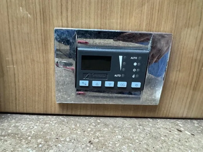  Yacht Photos Pics Control panel on 2013 Formula 350 Sun Sport boat, mounted on wooden surface.