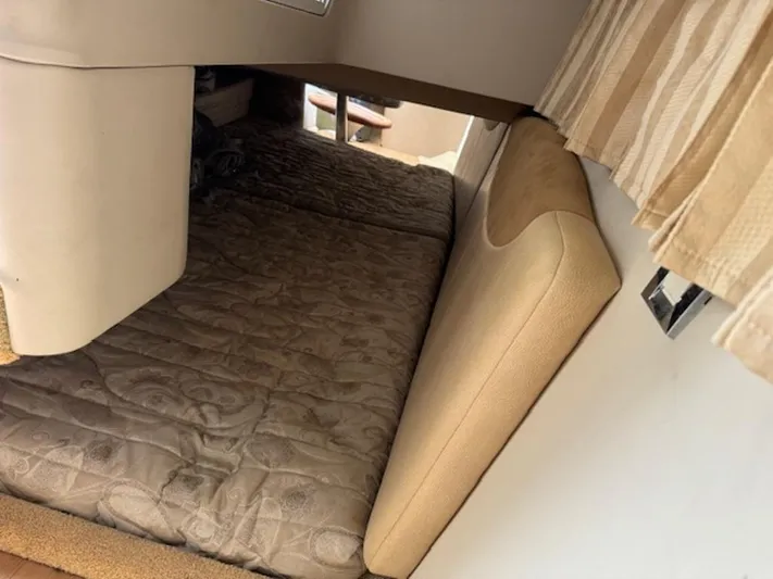  Yacht Photos Pics Interior cabin of 2013 Formula 350 Sun Sport with cushioned seating and curtains.